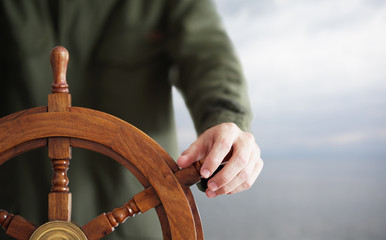 Hand on ship rudder. © Anton Sokolov
