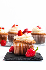 Food concept Fresh homemade strawberry whipped cream cupcake on white backfround