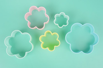 Close up of flower shaped of dessert plastic mold in multi color for background