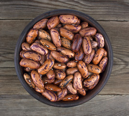 Haricot bean in bowl on wooden background