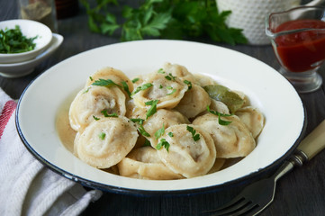 Homemade dumplings stuffed with ground beef in a bowl