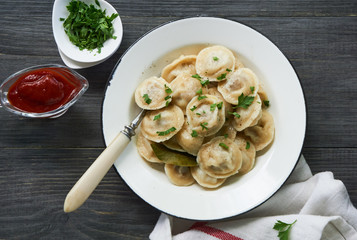 Homemade dumplings stuffed with ground beef in a bowl