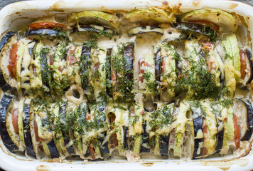 Grilled vegetables Zucchini Eggplant Tomato a Kind of Ratatouille on a rustic wooden background