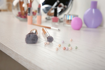 Professional cosmetic brushes on table