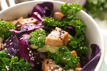 Tasty salad with meat and parsley in bowl, closeup