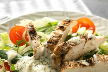 Tasty salad with meat and cherry tomatoes on plate