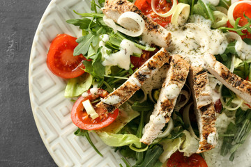 Tasty salad with meat and cherry tomatoes on plate