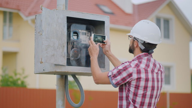 The inspector takes pictures of the meter reading