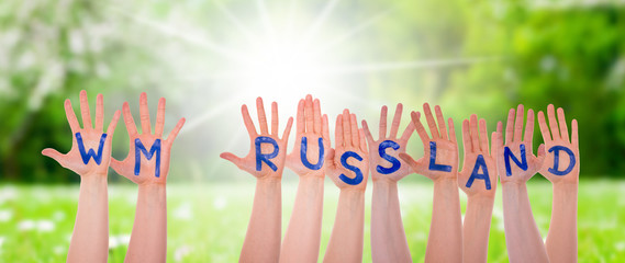 Hands With WM Russland Means Russia 2018, Sunny Grass Meadow