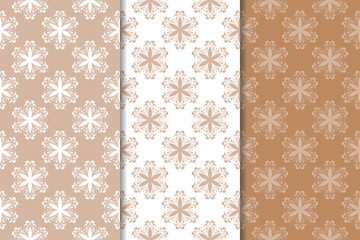 Brown floral ornaments. Set of seamless backgrounds
