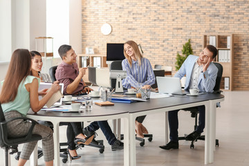 Young people having business meeting in office