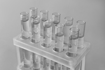 Test tubes with water on light background