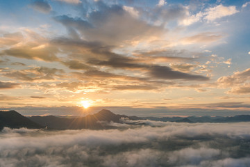 Fototapeta premium beautiful sunrise over mountain with fog 