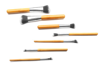 Set of cosmetic brushes on white background, top view