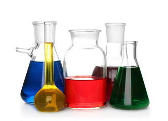 Chemical glassware with colorful samples on white background