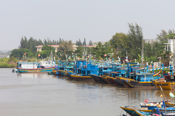Mui Ne, Vietnam-December 27, 2013. Vietnamese fishing boats on the river near Mui Ne at Phan Tiet a...