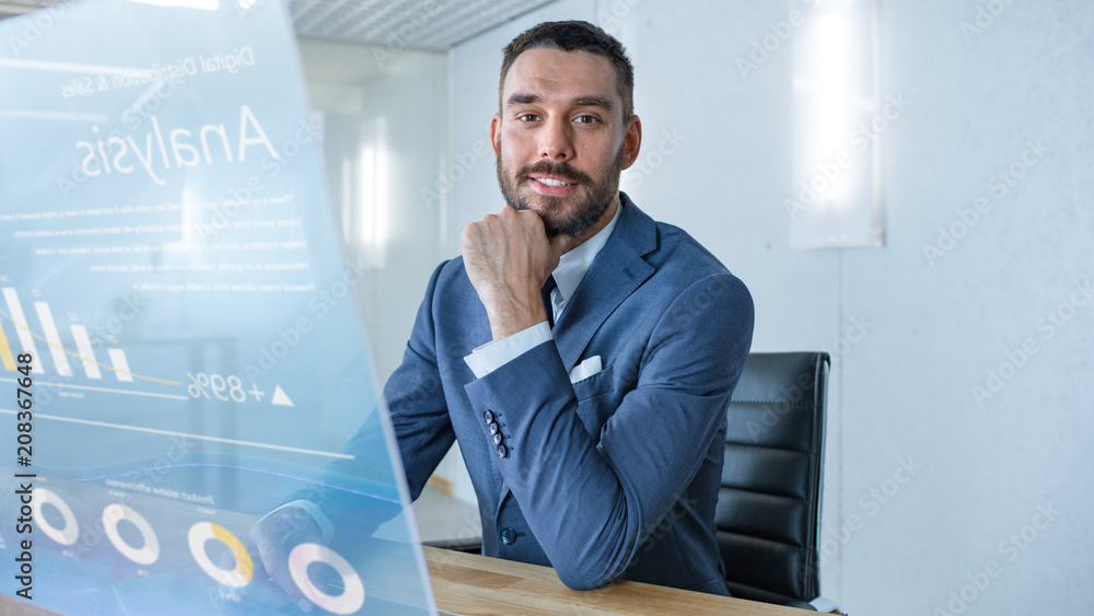 Poster in the near future successful businessman works on computer with transparent display that shows stoc