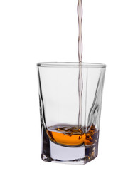 dark stood in a barrel of alcoholic drink poured in a glass