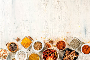 Set of various spices on light concrete background. Top view copy space.