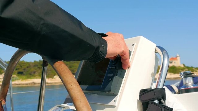 Skipper setting up course on sailing boats navigation gps plotter. Filmed on sailing trip in Croatia in slow motion hd.