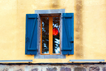 Obraz premium Traditional French window with shutters, Agde, France. Copy space for text.