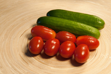 tomatoes and cucumbers on the board