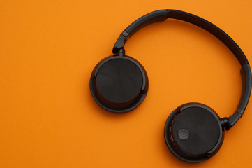 headphones on an orange background
