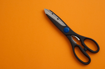scissors on an orange background