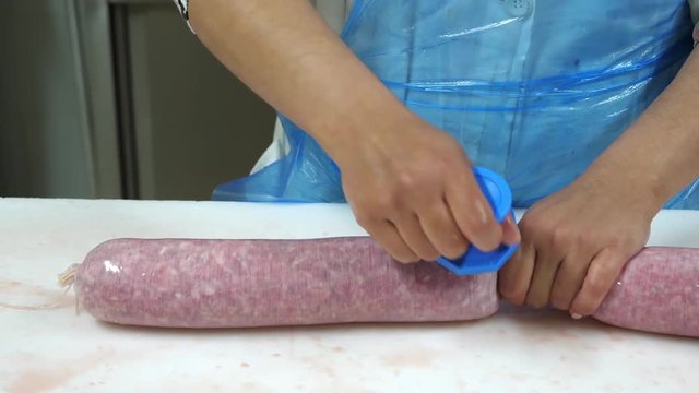 Food industry, traditional production of salami. Filmed in 4K, dolly shot