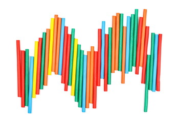 Colorful decorative sticks isolated on white background, top view