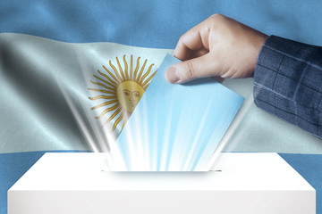 Argentina - Voting On Ballot Box With National Flag Background 