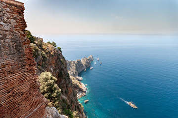 Shot of a cape laying at the blue sea