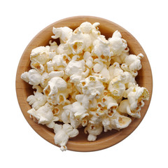 Food: wooden bowl full of popcorn, isolated on white background