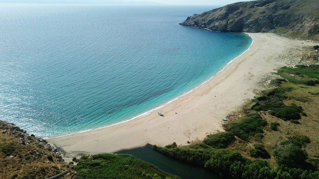 Aerial drone bird's eye view photo of iconic beach of Potami or River with turquoise clear waters, South Evia island, Greece