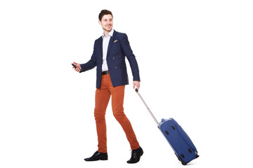 Full body businessman walking with mobile phone and luggage against  isolated white background
