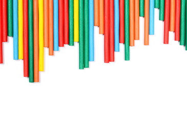 Colorful decorative sticks isolated on white background, top view