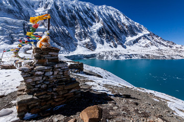 Stone stupa with prayer flags near Tilicho lake. Nepal, Himalaya mountains, Annapurna Conservation Area
