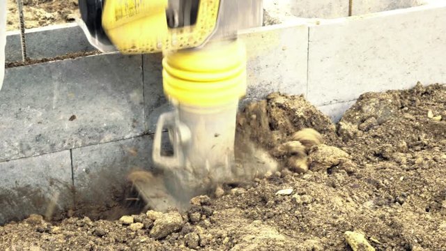 Jumping Jack Compactor, vibratory blower, mechanical jump. Compaction machines, machines for earth compaction. Detail of ground works, construction industry