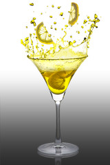 a splash of lemon cocktail on a white