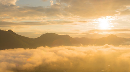 sunrise over mountain with fog 