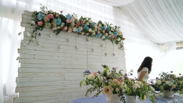 Flowers event wedding decoration. Beautiful florist creating spring colorful bouquet arrangement. Process of preparing floral composition for celebrating party.