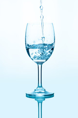 Water splashing into a glass