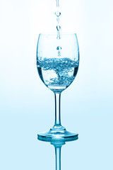 Water splashing into a glass
