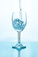 Water splashing into a glass