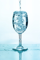 Water splashing into a glass