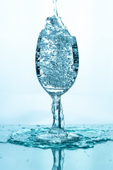 Water splashing into a glass