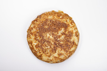 Omelette with potatoes on white background, isolated. Typical spanish food.