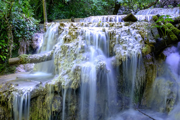 Fototapeta na wymiar Multilevel waterfall on a rocky terrain 2