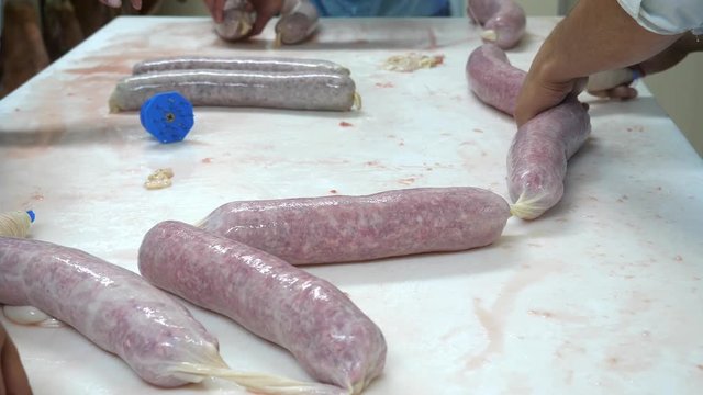 Meat industry, traditional production of salami. Slow motion, dolly shot