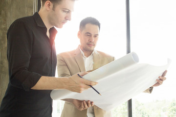 Home construction with architects planning to build a new residence.